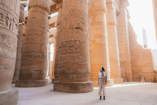 woman walking in the ancient Egyptian temple in Luxor